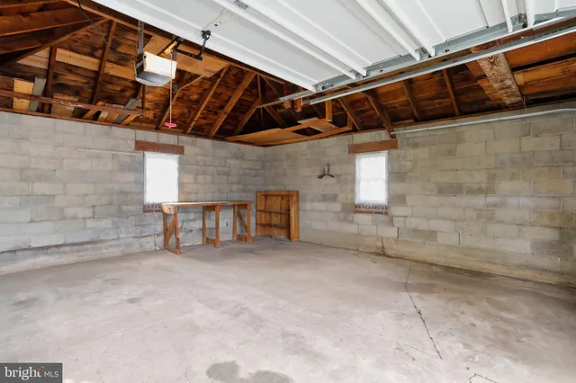 a view of a room with wooden walls