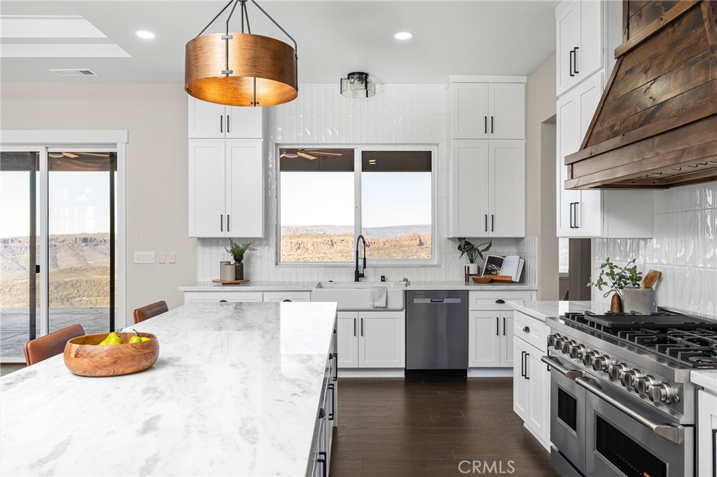 163 Valley Ridge Drive Paradise, CA 95969 - Photo 19 of 69 a kitchen with stainless steel appliances a stove a sink and a refrigerator