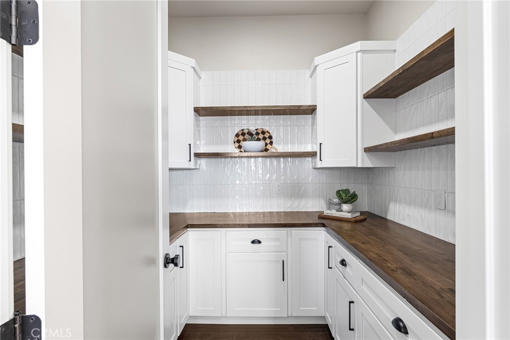 163 Valley Ridge Drive Paradise, CA 95969 - Photo 22 of 69 a kitchen with a cabinets and a stove with wooden floor