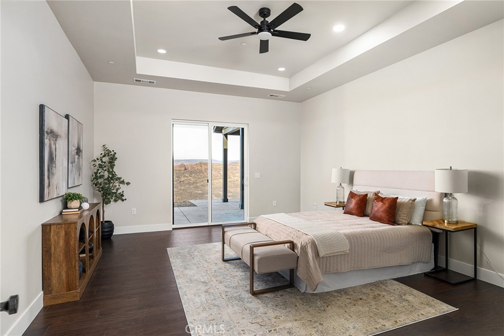 163 Valley Ridge Drive Paradise, CA 95969 - Photo 27 of 69 a bedroom with a large bed and a chandelier