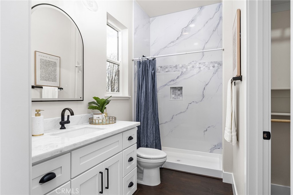 163 Valley Ridge Drive Paradise, CA 95969 - Photo 40 of 69 a bathroom with a double vanity sink toilet and shower