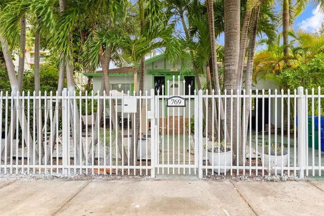a view of a house with a small yard
