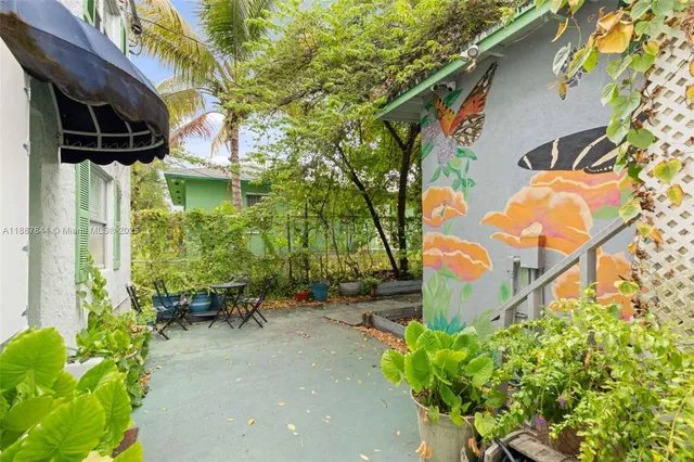 a backyard of a house with outdoor seating