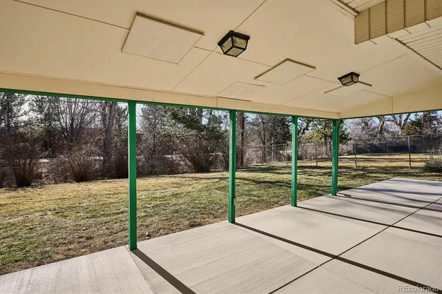a view of a room with wooden floor and porch