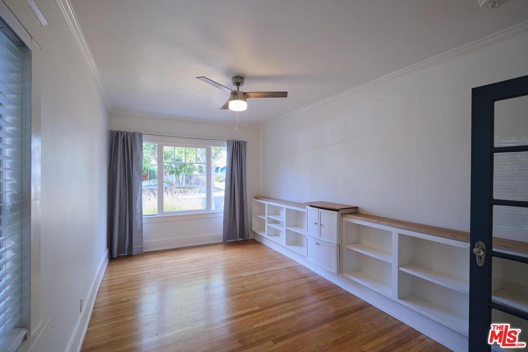 9030 Carson Street Culver City, CA 90232 - Photo 11 of 19 a view of empty room with wooden floor and fan
