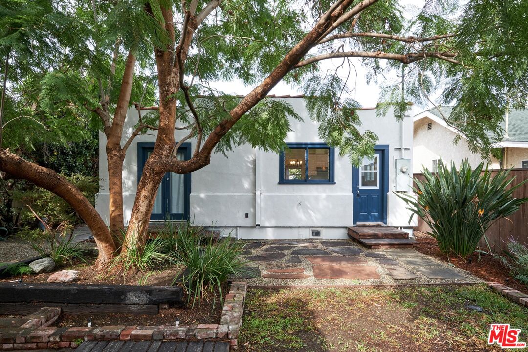 9030 Carson Street Culver City, CA 90232 - Photo 13 of 19 a front view of a house with a yard