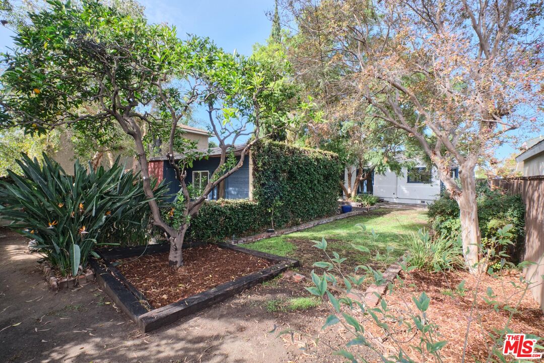 9030 Carson Street Culver City, CA 90232 - Photo 16 of 19 a front view of a house with garden