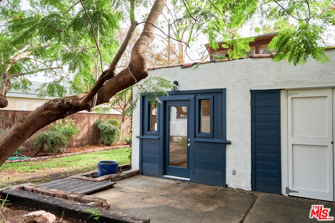 9030 Carson Street Culver City, CA 90232 - Photo 17 of 19 a front view of a house with a yard