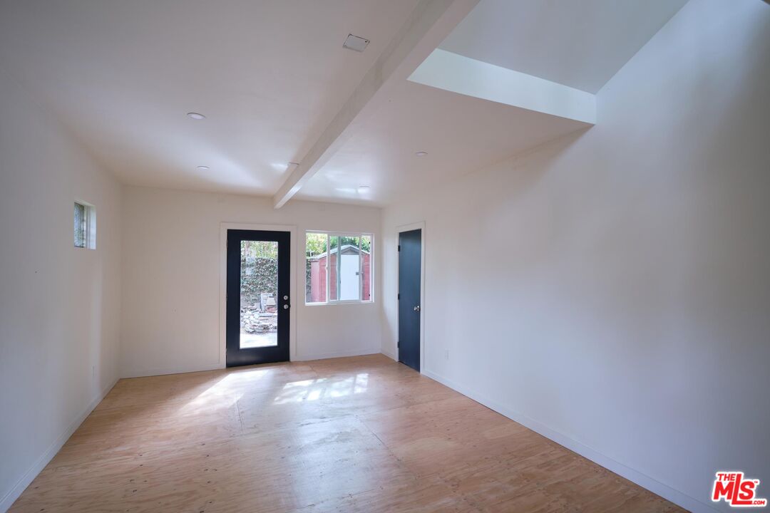 9030 Carson Street Culver City, CA 90232 - Photo 18 of 19 a view of a big room with windows and chandelier fan