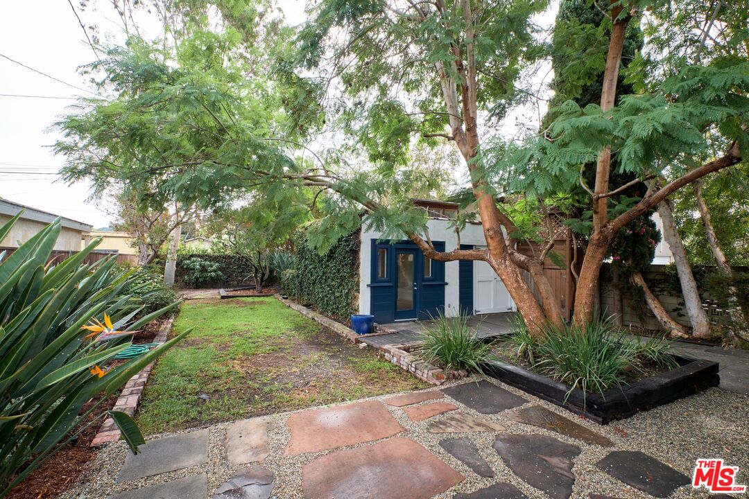 9030 Carson Street Culver City, CA 90232 - Photo 19 of 19 a backyard of a house with plants and large trees