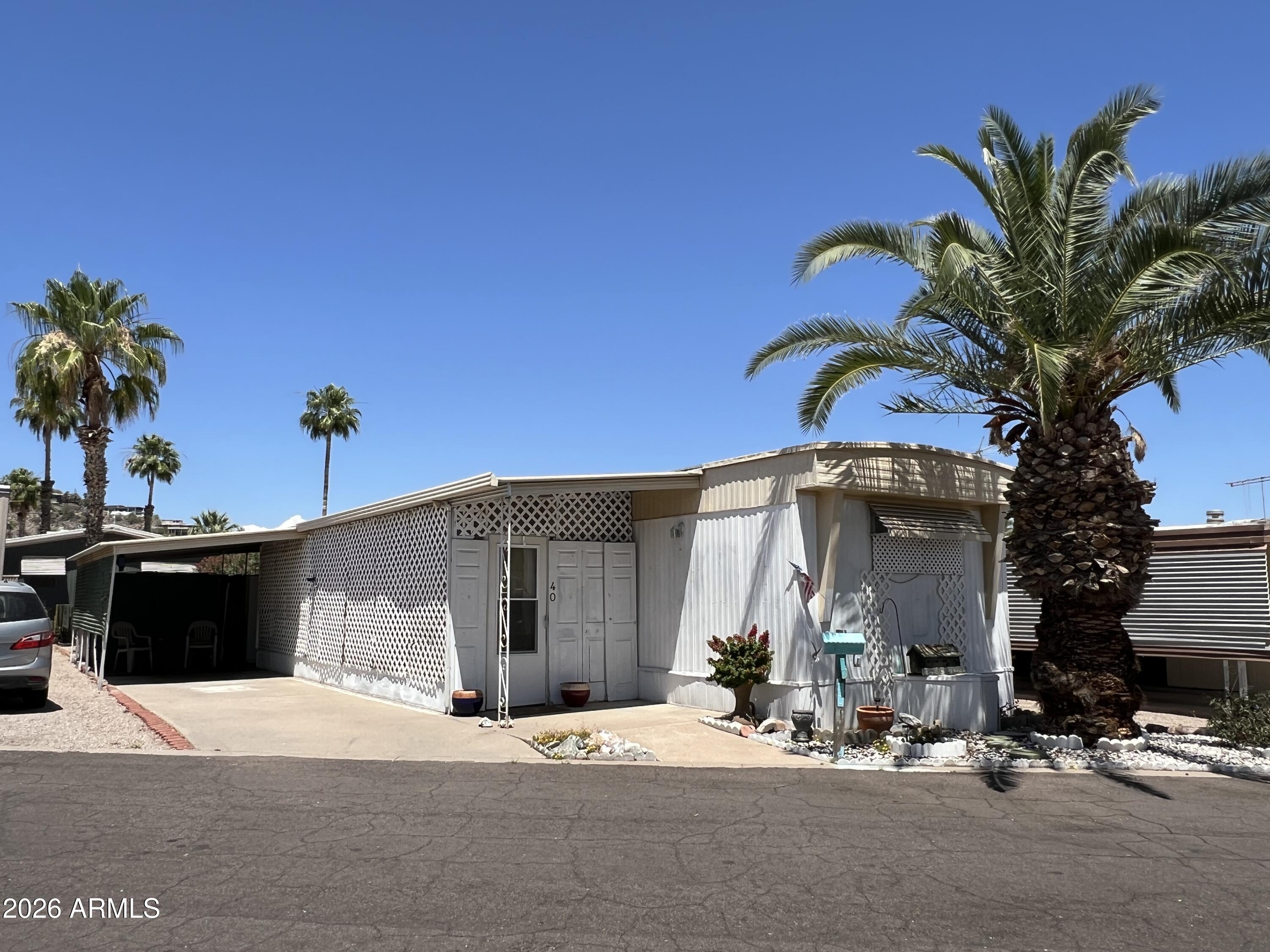 19225 North Cave Creek Road, Unit 40 Phoenix, AZ 85024 - Photo 2 of 21 a view of a house with a patio