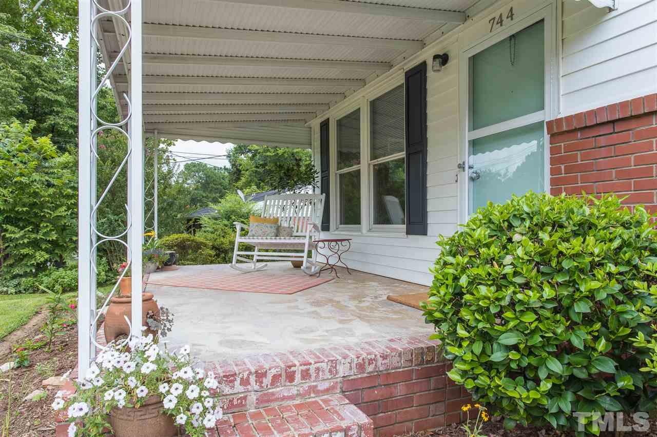 744 Fitzgerald Drive Raleigh, NC 27610 - Photo 3 of 28 a garden view with a seating space