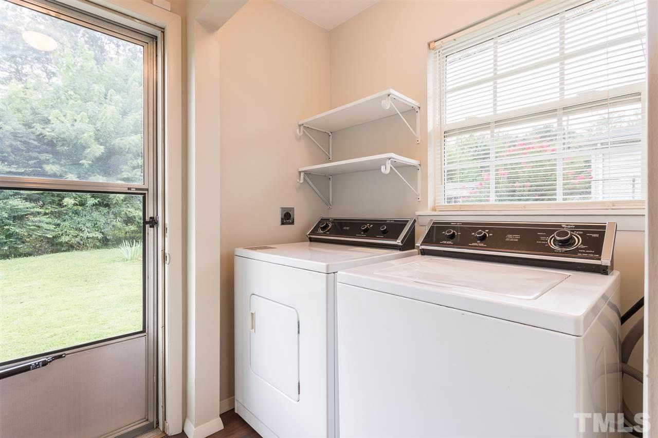 744 Fitzgerald Drive Raleigh, NC 27610 - Photo 21 of 28 a stove top oven sitting inside of a kitchen