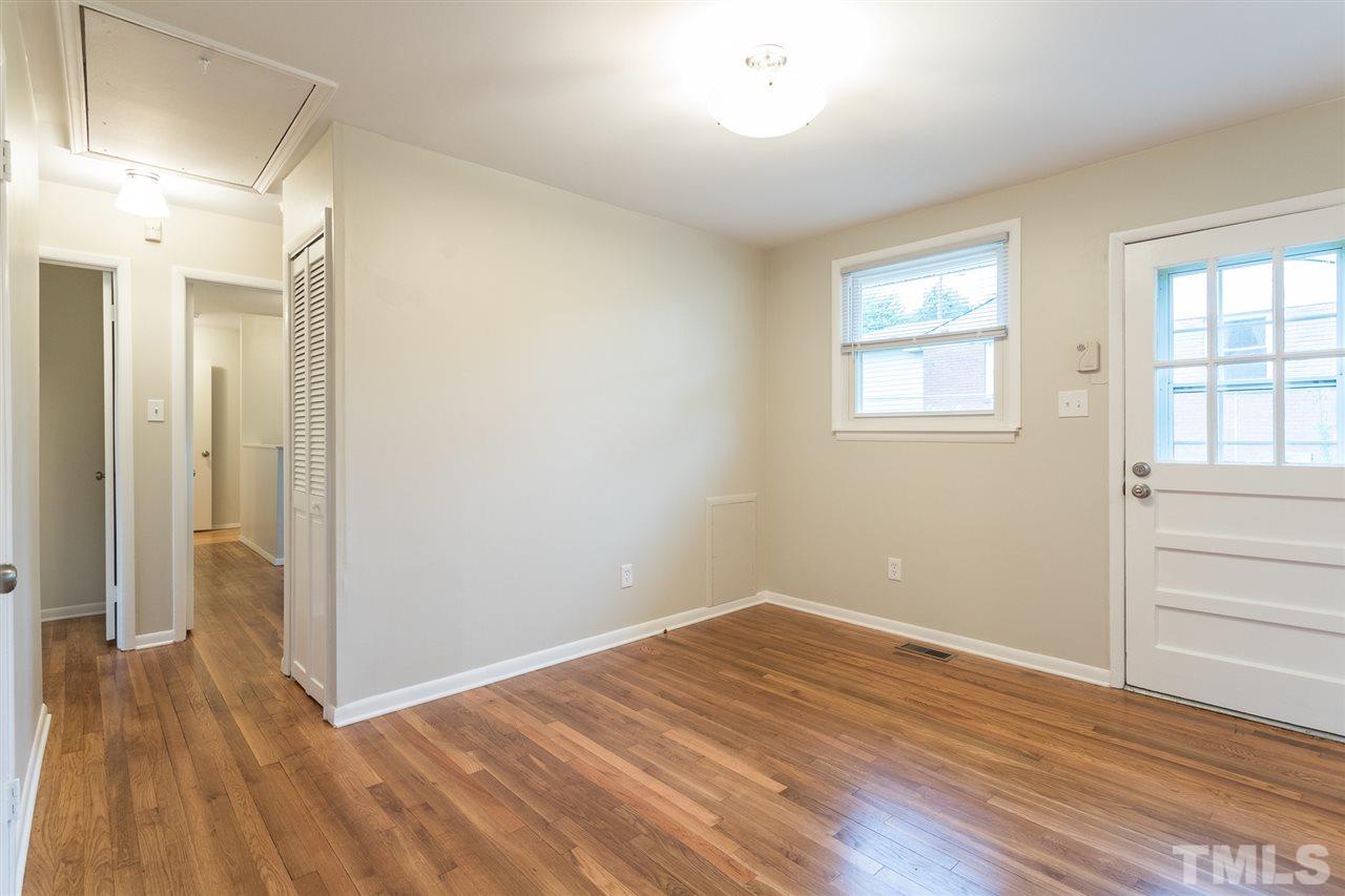 744 Fitzgerald Drive Raleigh, NC 27610 - Photo 8 of 28 wooden floor in an empty room with a window