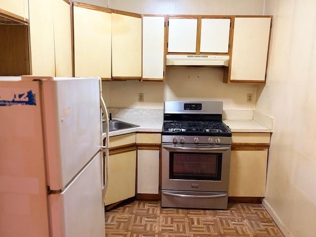 644 New York Avenue, Unit 2 Brooklyn, NY 11203 - Photo 2 of 10 a kitchen with granite countertop white cabinets and white appliances