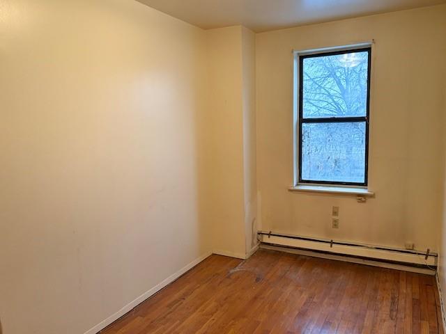 644 New York Avenue, Unit 2 Brooklyn, NY 11203 - Photo 7 of 10 a view of an empty room with wooden floor and a window