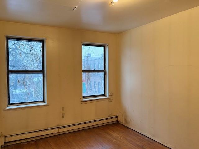 644 New York Avenue, Unit 2 Brooklyn, NY 11203 - Photo 8 of 10 a view of an empty room with wooden floor and hallway
