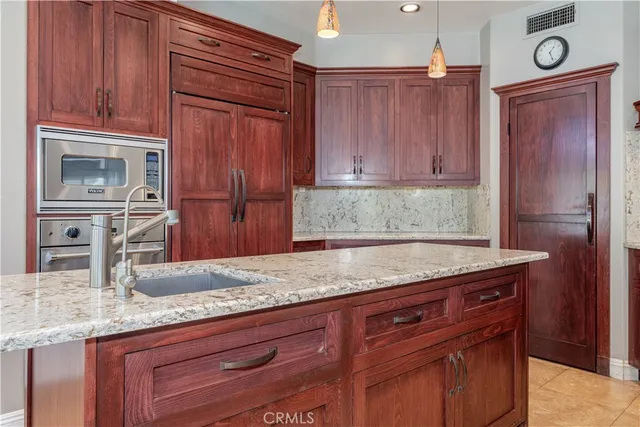 a view of a dining room with furniture and a window