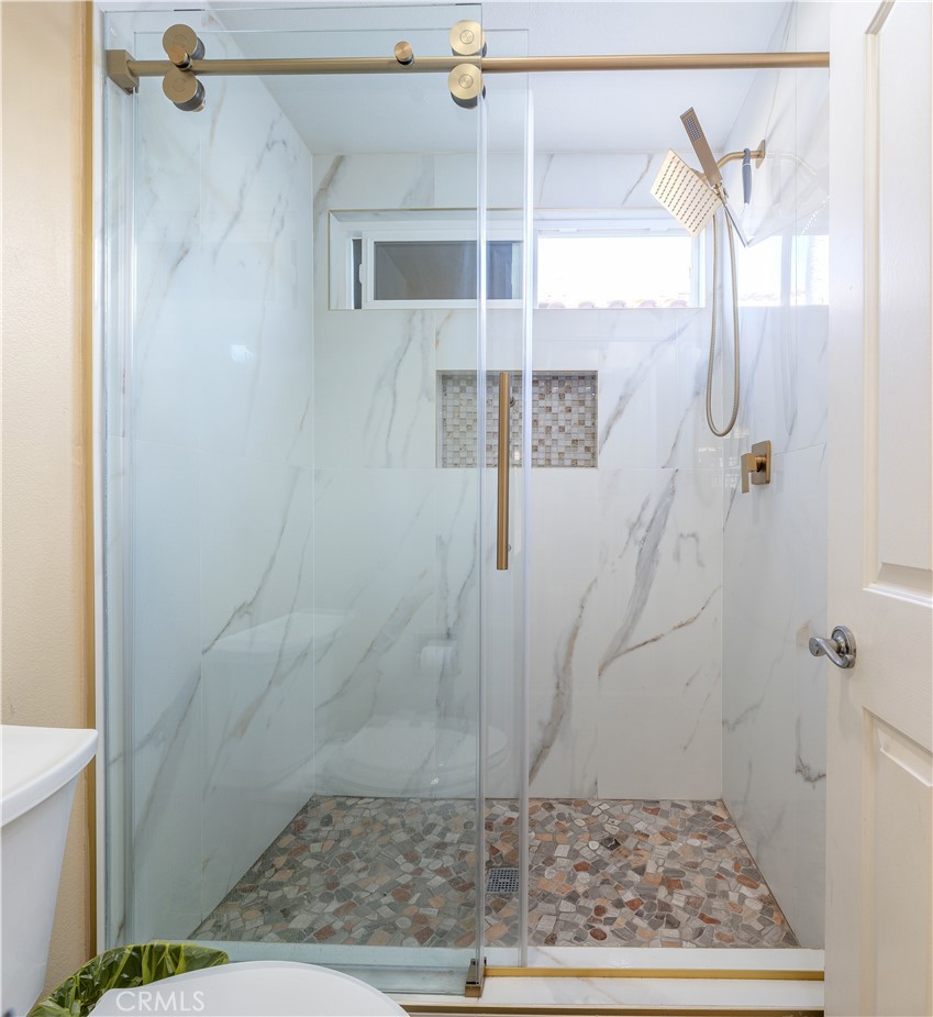 9574 Tivoli Circle Cypress, CA 90630 - Photo 24 of 68 a bathroom with a shower
