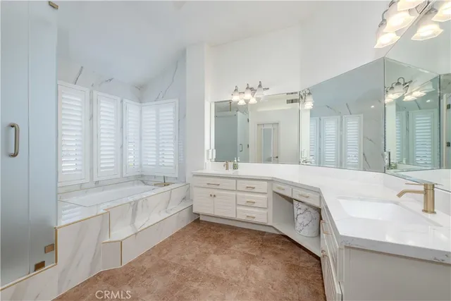 a view of walk in closet with clothes