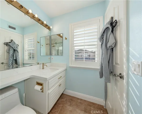 a bathroom with a shower and a toilet
