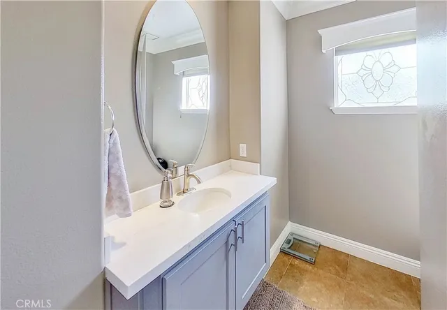 a view of a patio with table and chairs and potted plants