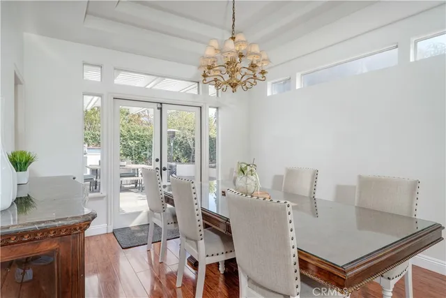 a kitchen with granite countertop a sink and a wooden cabinets