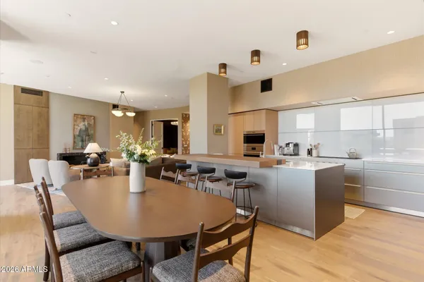 a view of a dining room with furniture and wooden floor
