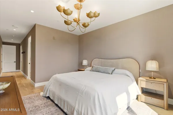 a bedroom with a large bed and a window