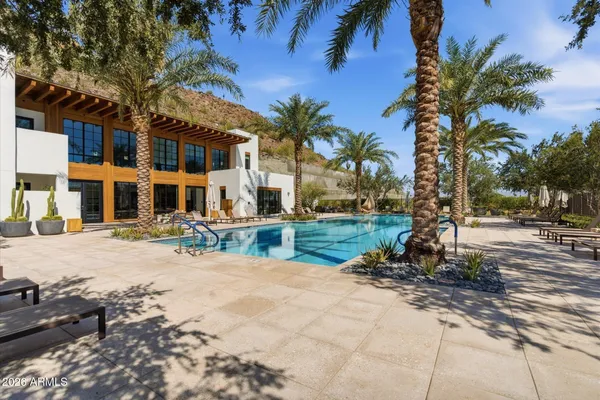 a living room with furniture large window and flat screen tv