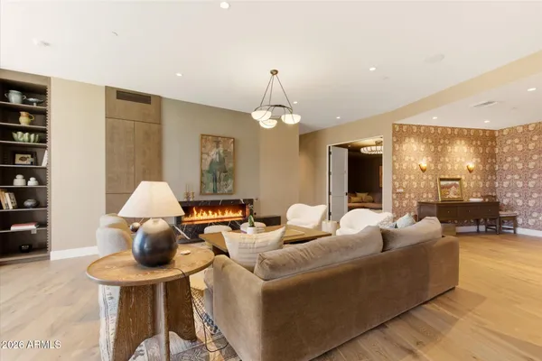 a living room with furniture and a large window