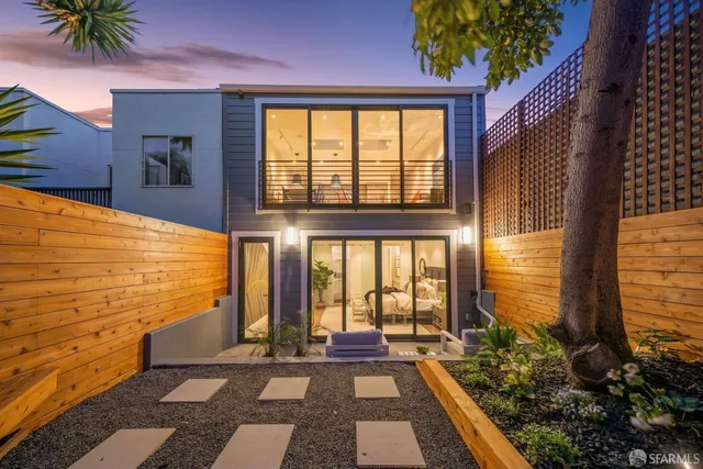 a view of a balcony with chair and a potted plant