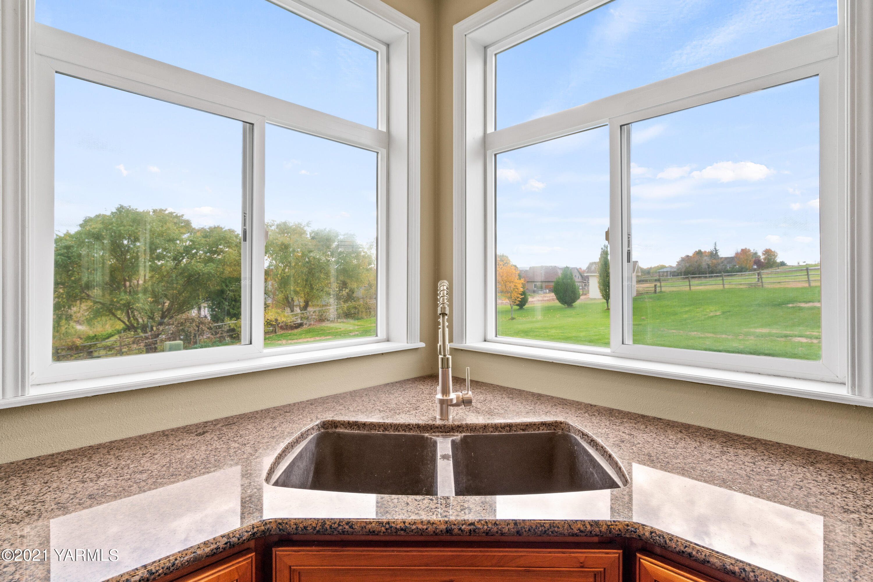 10807 Zier Road Yakima, WA 98908 - Photo 18 of 44 a kitchen view with a sink and outdoor view