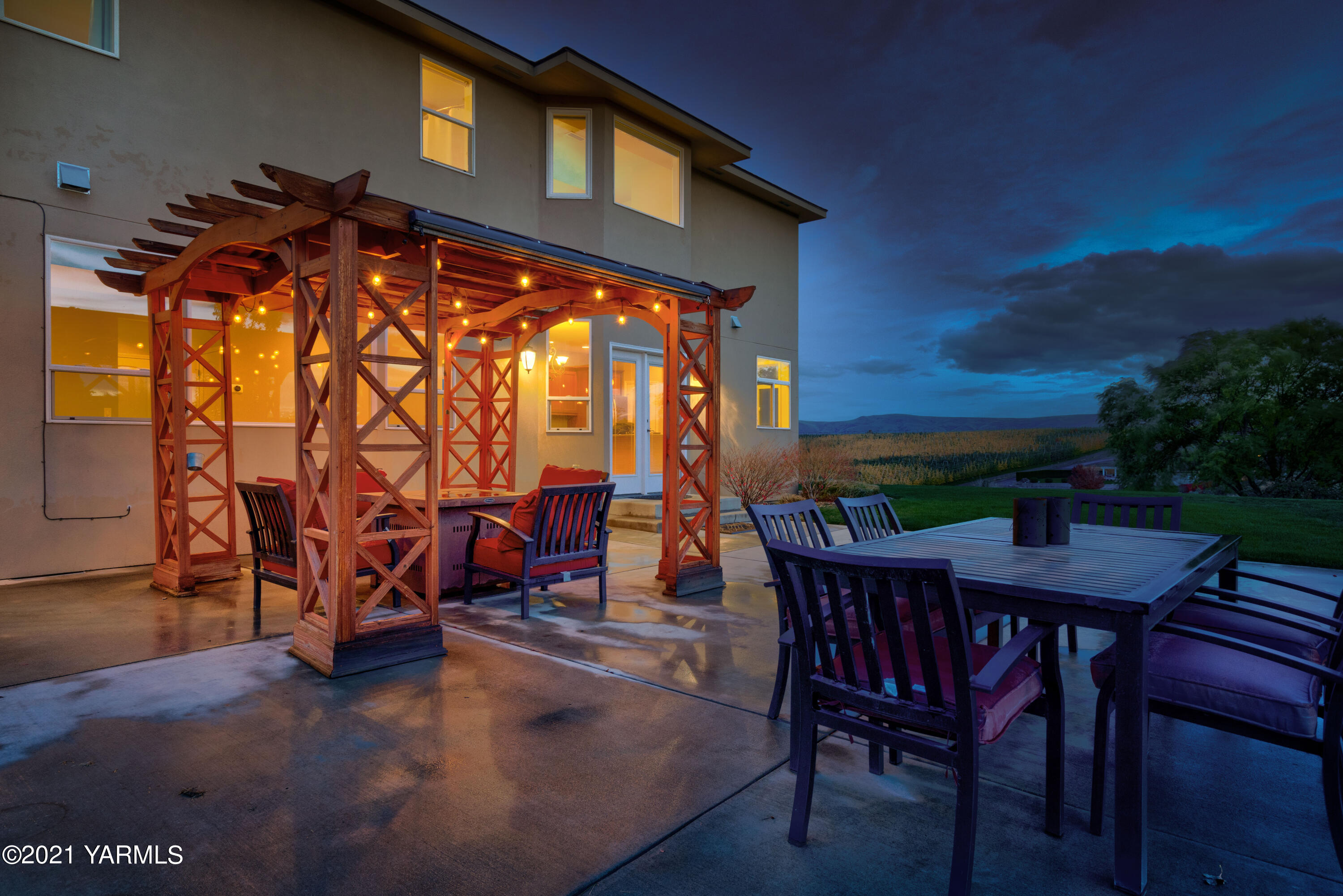 10807 Zier Road Yakima, WA 98908 - Photo 4 of 44 a backyard of a house with barbeque oven table and chairs