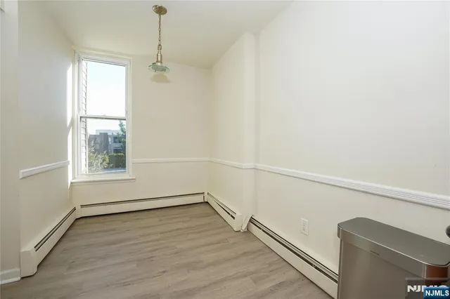 a view of a room with a large window