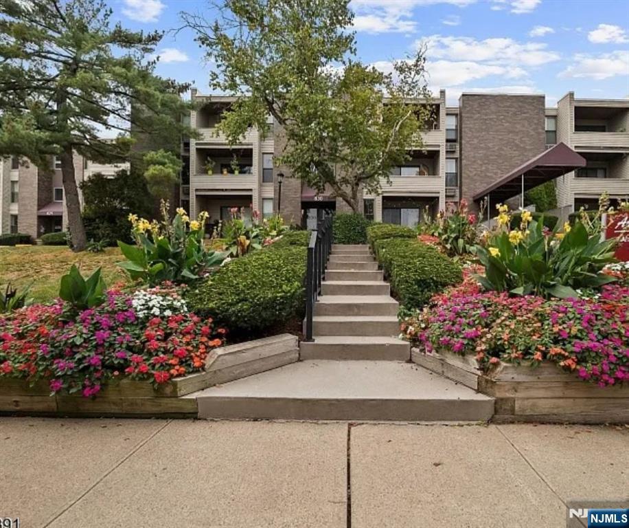 1 River, Unit 3G Nutley, NJ 07110 - Photo 23 of 27 a front view of a house with a yard