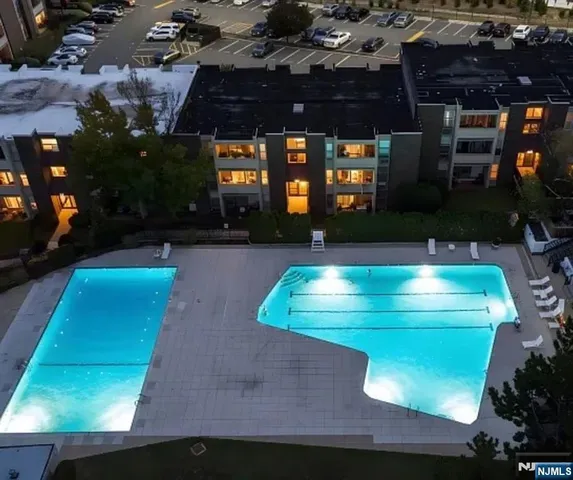 a view of a swimming pool with a patio