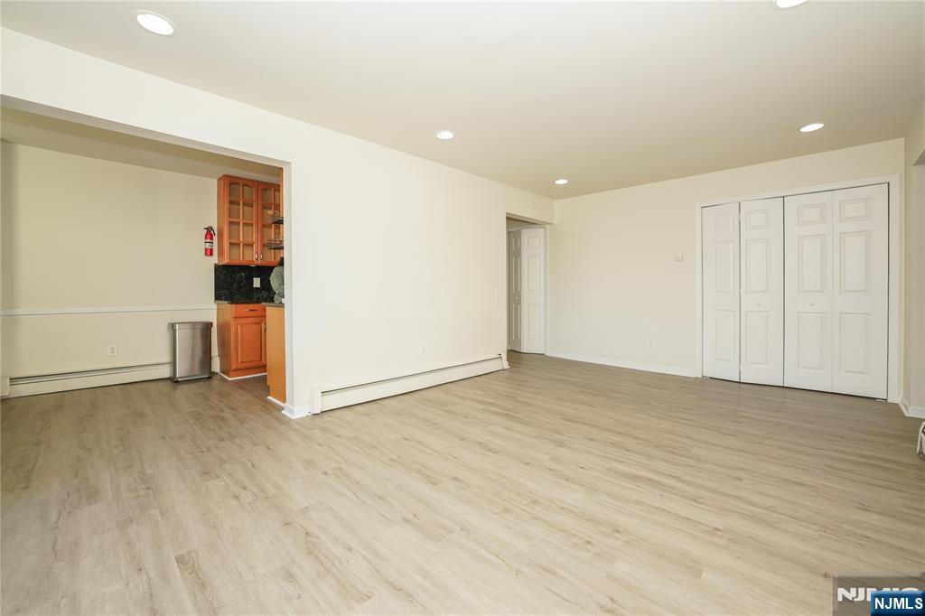 1 River, Unit 3G Nutley, NJ 07110 - Photo 7 of 27 a view of empty room with wooden floor