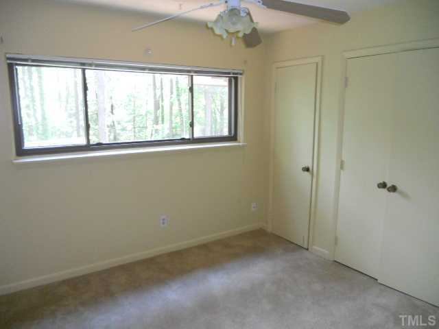 654 Pine Ridge Place Raleigh, NC 27609 - Photo 5 of 7 an empty room with a window