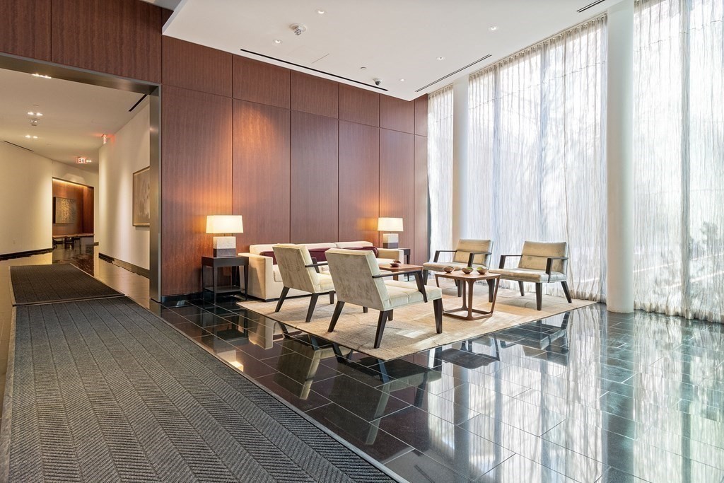 580 Washington Street, Unit 1207 Boston, MA 02111 - Photo 11 of 16 a view of a dining room with furniture window and outside view