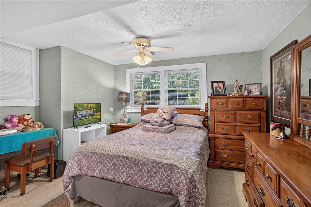 104 Laurel Lane Seneca, SC 29678 - Photo 22 of 36 Relaxation awaits in this comfortable bedroom, featuring a bright window and practical tile flooring.