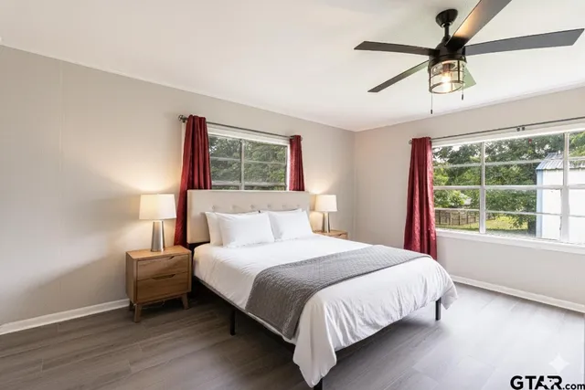 a bedroom with a bed and a window