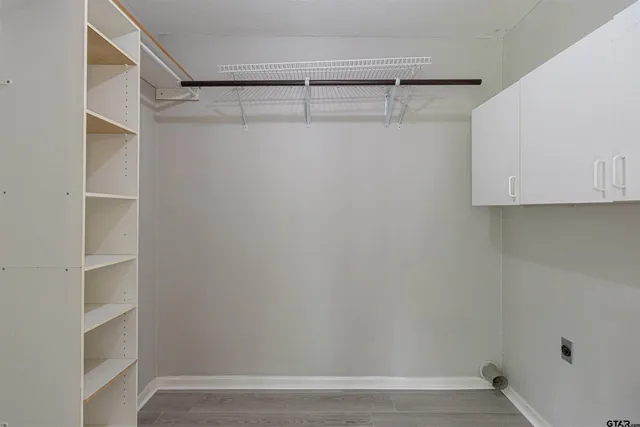 a view of an empty walk in closet