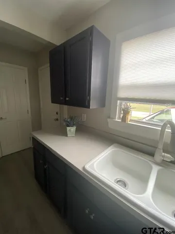 a kitchen with a sink and a window