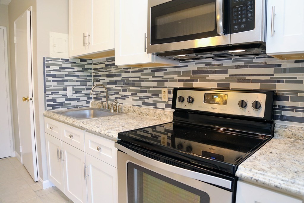 40 Cochituate Road, Unit 45 Framingham, MA 01701 - Photo 3 of 9 a stove top oven sitting inside of a kitchen