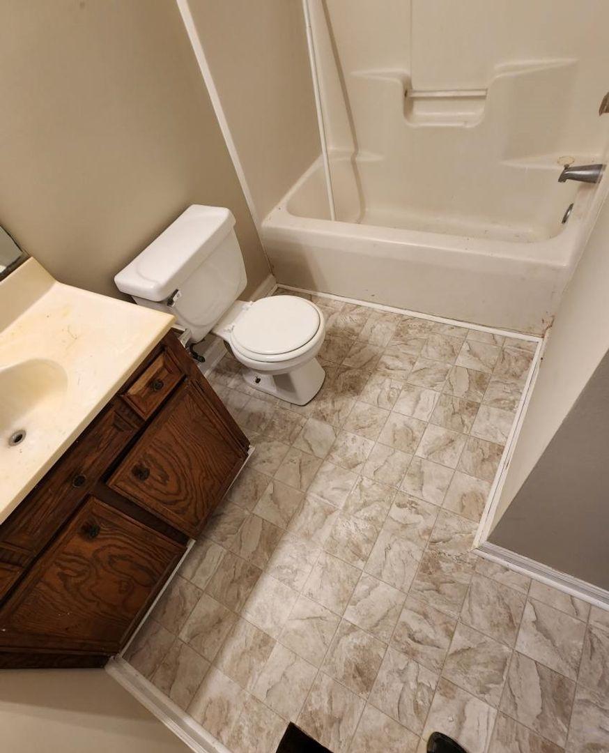 105 Starmount Road Clayton, NC 27520 - Photo 12 of 12 a bathroom with a sink and a toilet