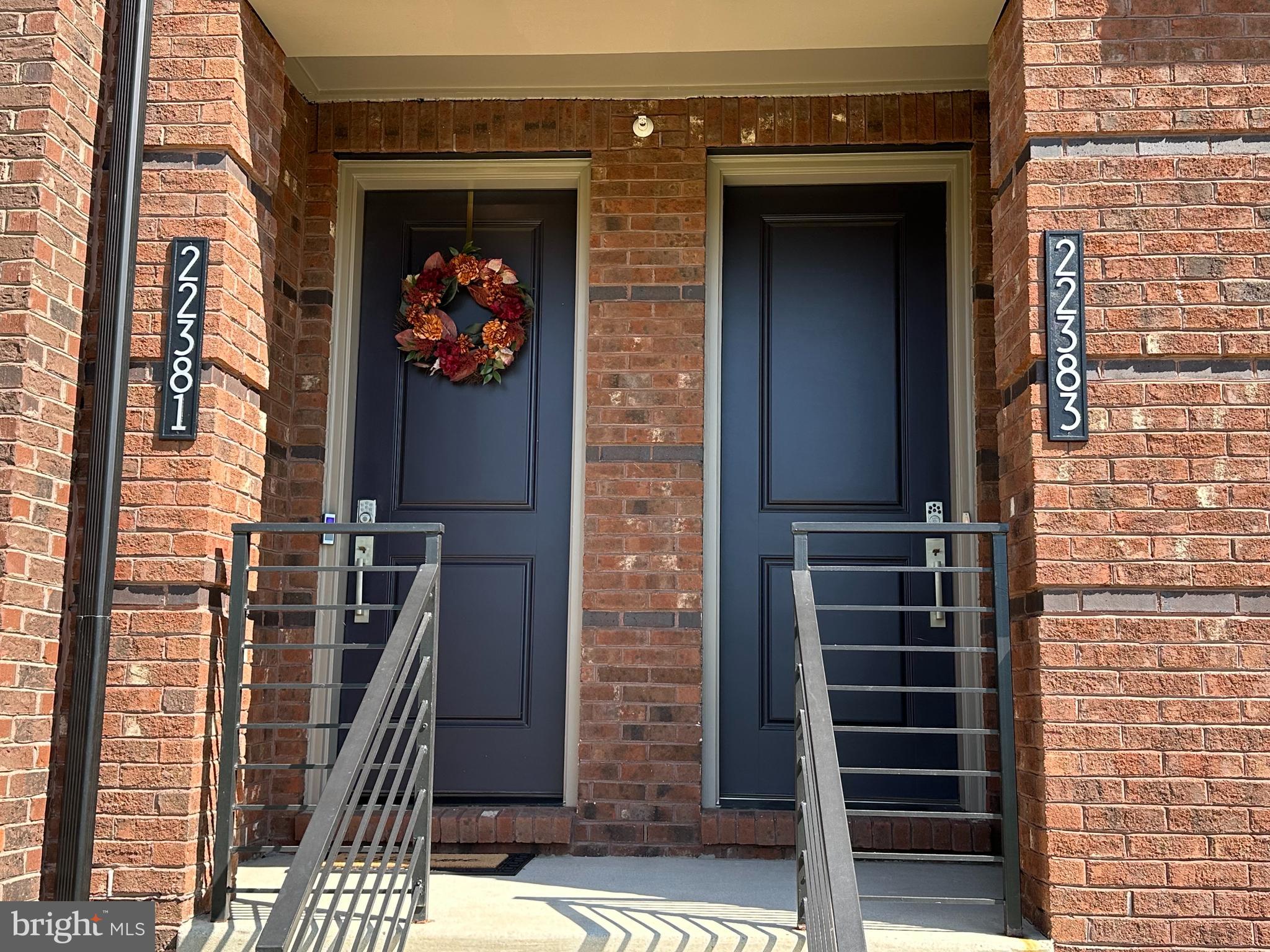 22381 Roanoke Rise Terrace Ashburn, VA 20148 - Photo 2 of 69 a front view of a house with a glass door