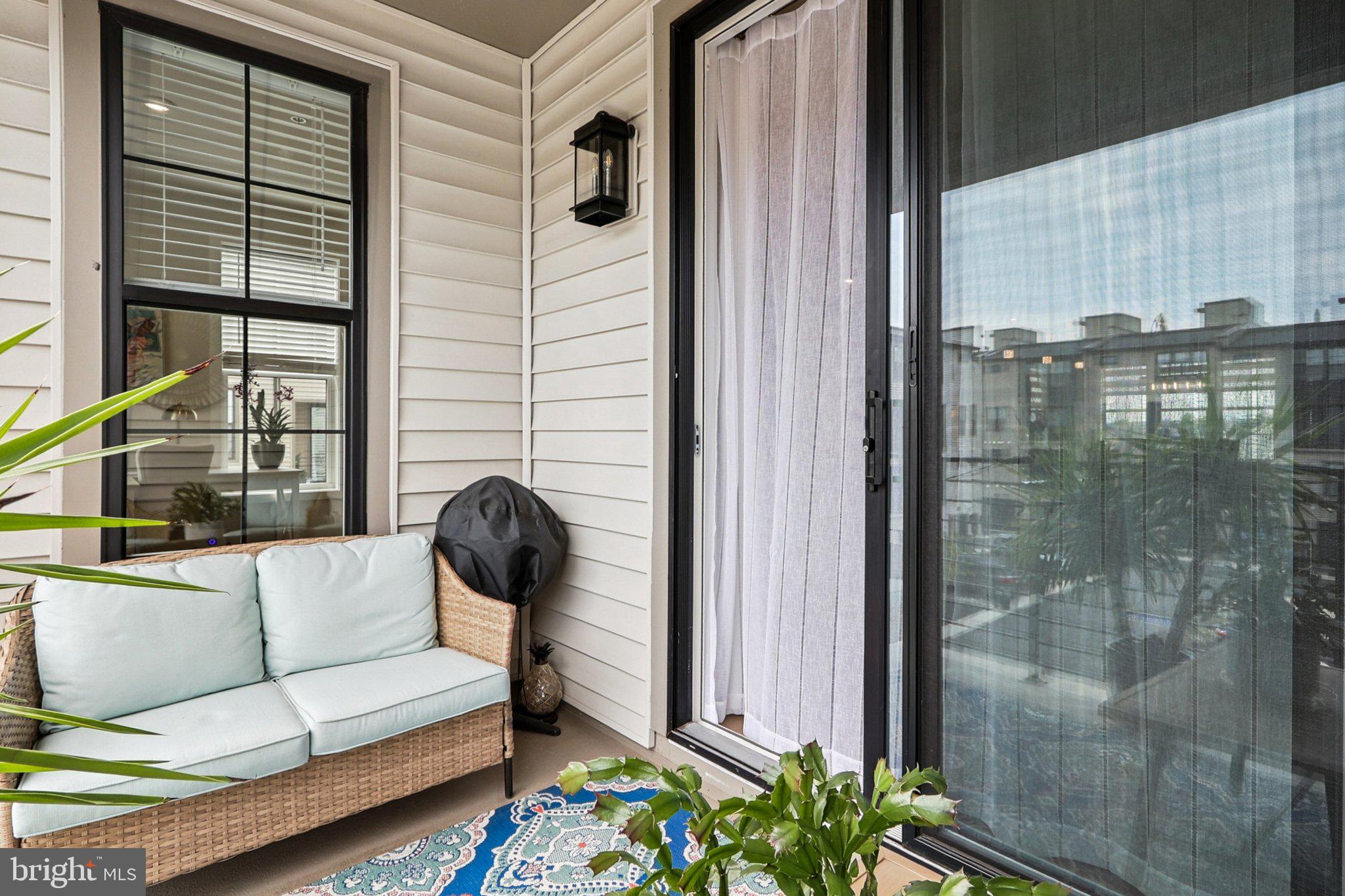 22381 Roanoke Rise Terrace Ashburn, VA 20148 - Photo 24 of 69 a view of a balcony with couches and a potted plant