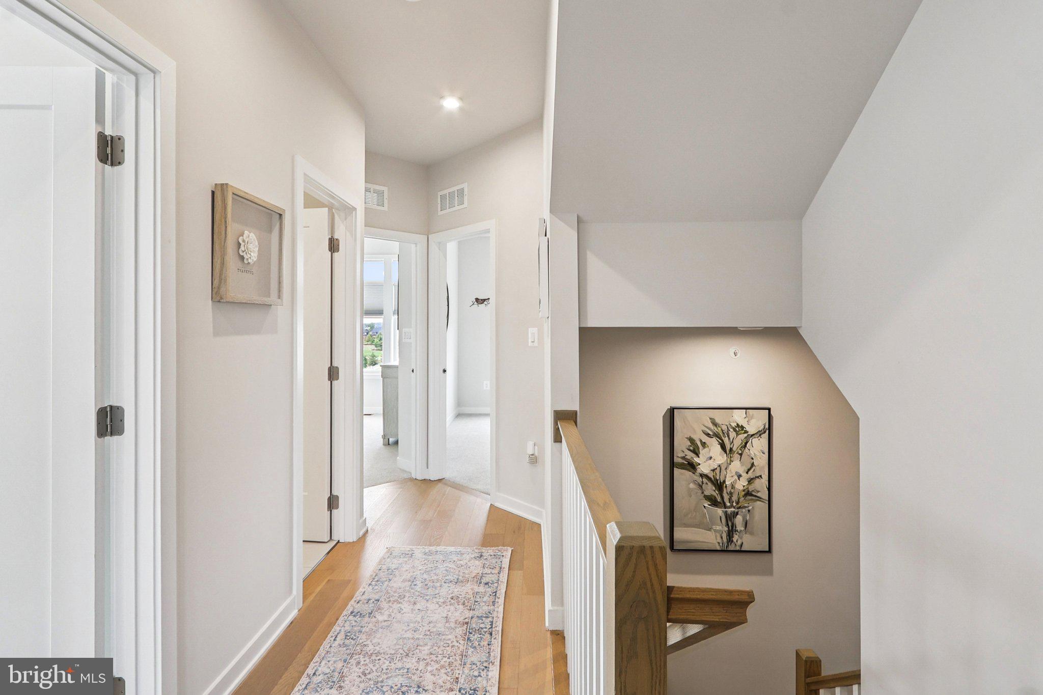 22381 Roanoke Rise Terrace Ashburn, VA 20148 - Photo 27 of 69 a view of a hallway with wooden floor and closet