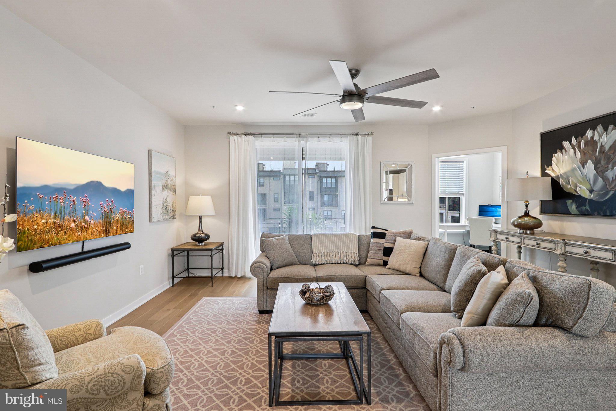 22381 Roanoke Rise Terrace Ashburn, VA 20148 - Photo 3 of 69 a living room with furniture a flat screen tv and a couch